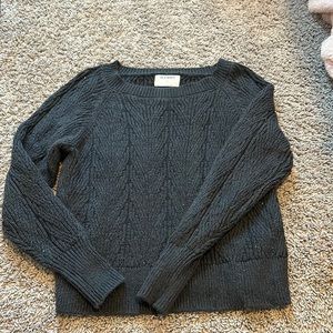 Women’s grey knit sweater.